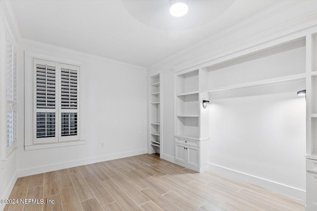 interior space featuring light hardwood / wood-style flooring and crown molding