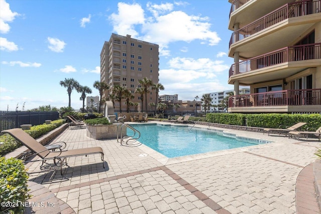 view of pool featuring a patio area