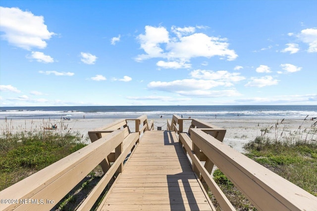 exterior space featuring a view of the beach and a water view