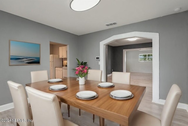 dining room with light hardwood / wood-style flooring