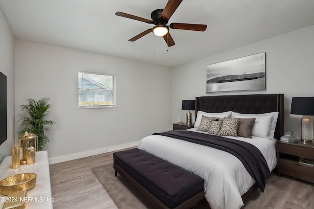 bedroom featuring ceiling fan and light hardwood / wood-style flooring