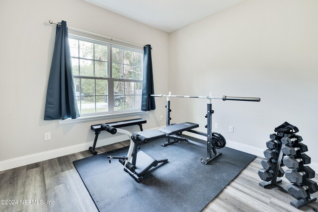 workout area featuring hardwood / wood-style floors