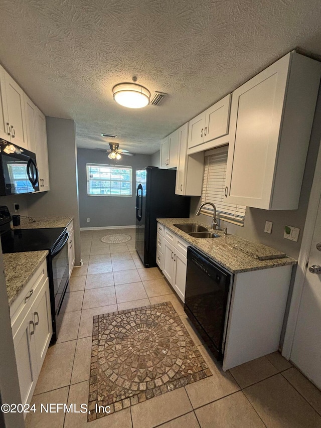 kitchen featuring ceiling fan, sink, white cabinetry, and black appliances