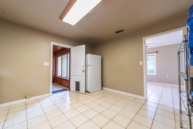 empty room with light tile patterned floors