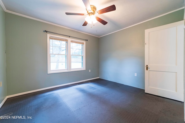 unfurnished room featuring dark carpet, ceiling fan, and ornamental molding