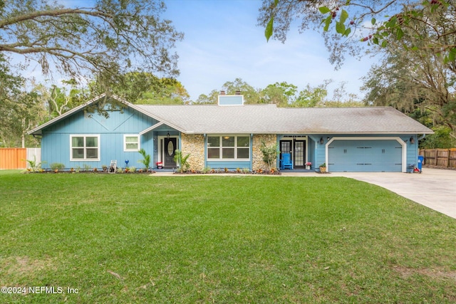 ranch-style house with a front yard and a garage