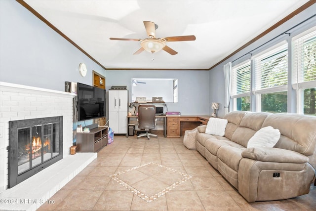 tiled living room featuring ornamental molding, built in desk, a fireplace, and ceiling fan