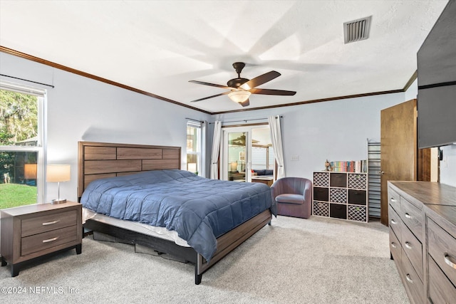 bedroom featuring ceiling fan, light carpet, ornamental molding, and a textured ceiling