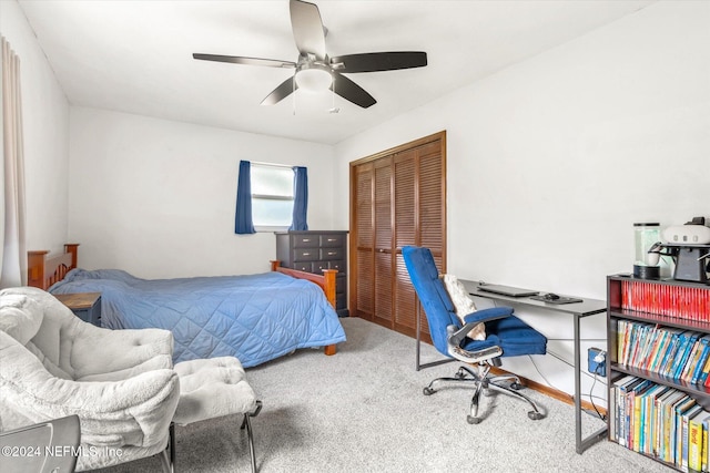 carpeted bedroom with a closet and ceiling fan