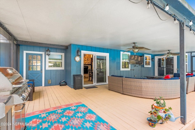 exterior space featuring outdoor lounge area and ceiling fan