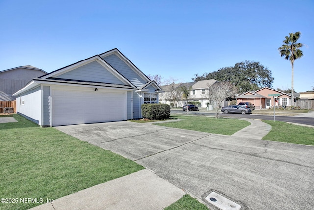 view of front of home with a garage and a front lawn