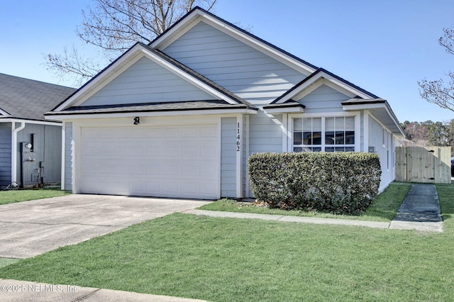 view of front facade featuring a garage and a front yard