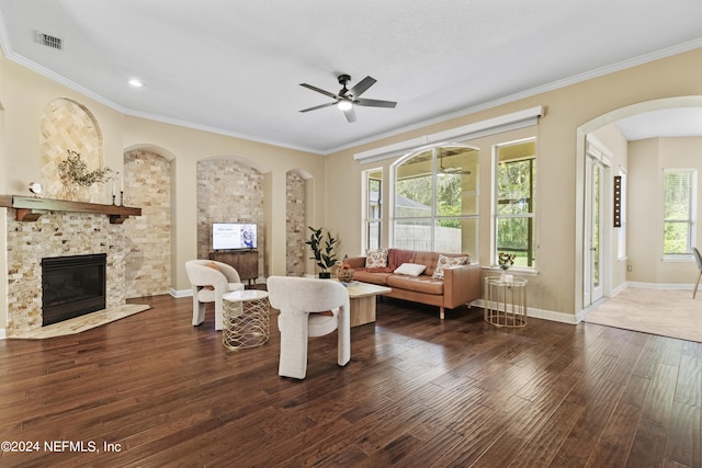 living room featuring ornamental molding, ceiling fan, and dark hardwood / wood-style floors