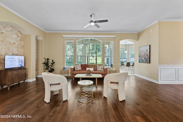 living room with ceiling fan, crown molding, and dark hardwood / wood-style flooring