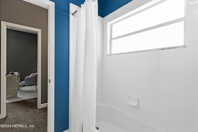 bathroom featuring shower / bath combination with curtain