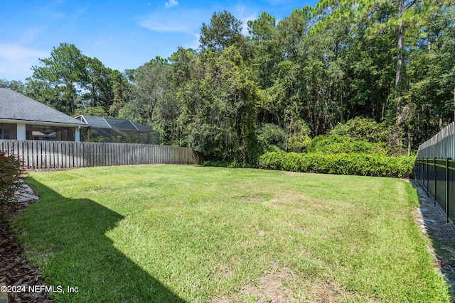 view of yard featuring a lanai