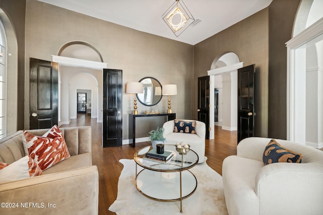 living room with dark hardwood / wood-style flooring