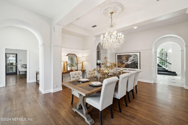 dining room with an inviting chandelier and dark hardwood / wood-style flooring