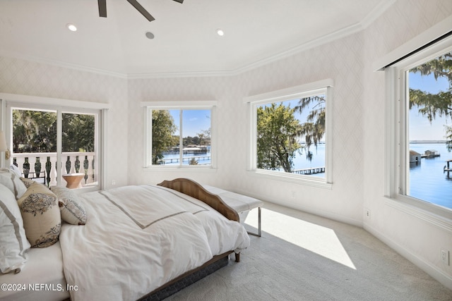 bedroom with ceiling fan, ornamental molding, carpet flooring, and a water view