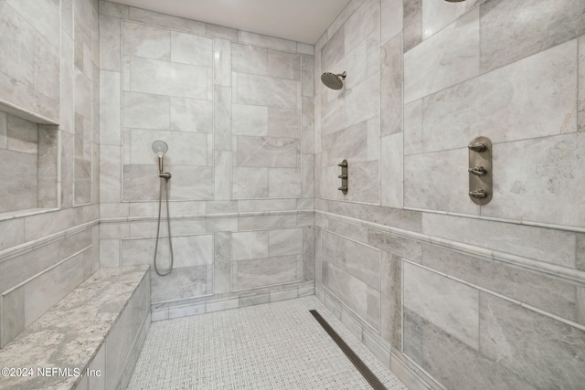 bathroom with a tile shower