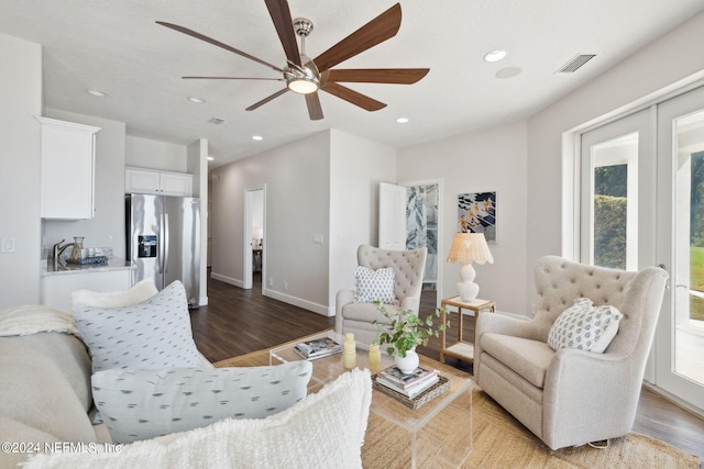 living room with light wood-type flooring and ceiling fan