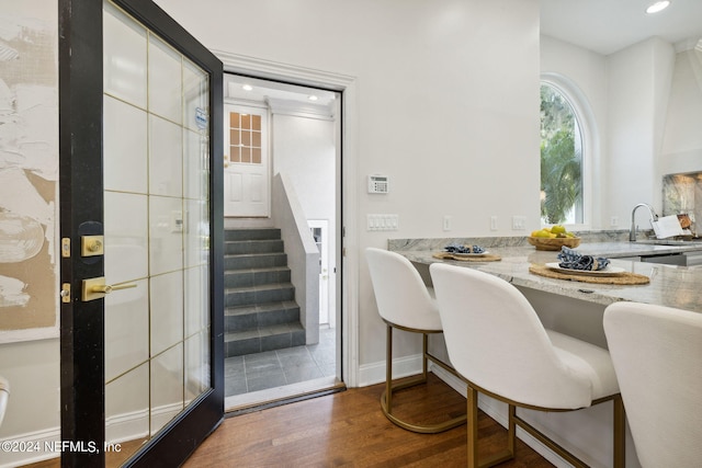 dining space featuring dark hardwood / wood-style flooring and sink