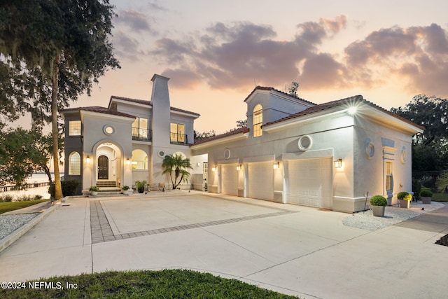 mediterranean / spanish-style house featuring a balcony