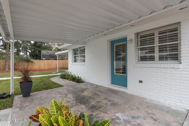 view of patio featuring fence