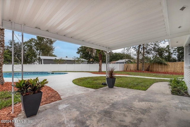 view of patio / terrace featuring a fenced in pool