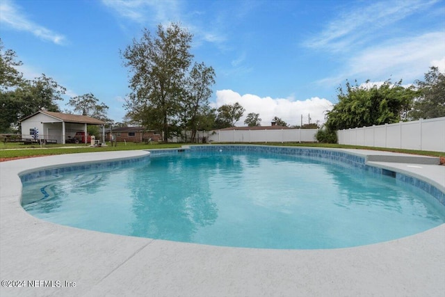 view of swimming pool featuring fence and a fenced in pool