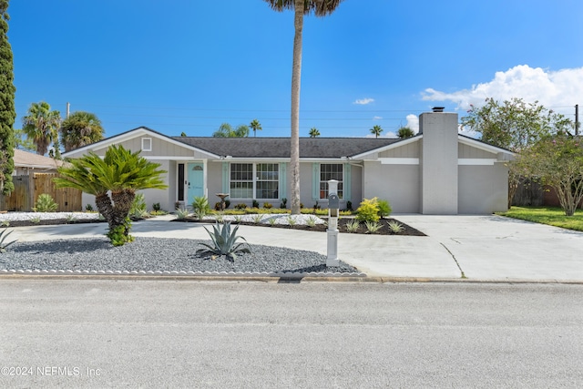 single story home with a garage