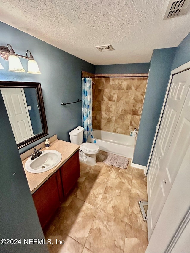 full bathroom featuring vanity, shower / bath combination with curtain, a textured ceiling, and toilet