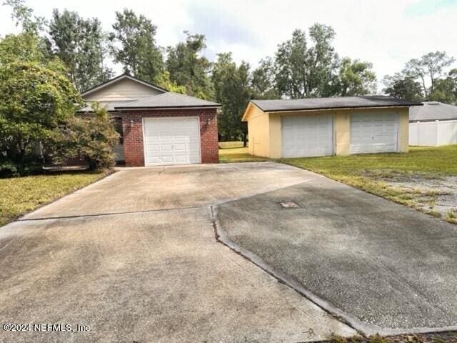 garage with a yard