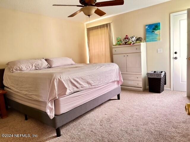 bedroom featuring carpet and ceiling fan