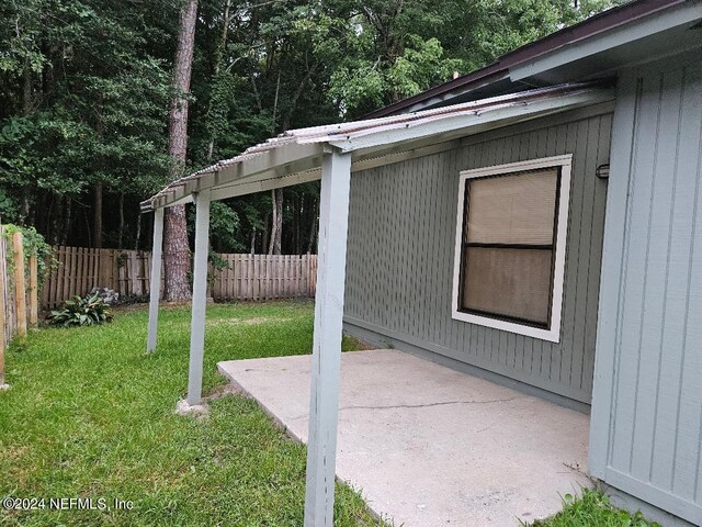 exterior space with a lawn and a patio