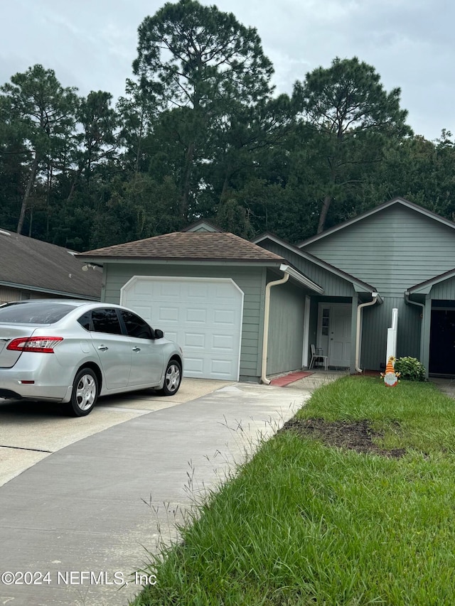 ranch-style house featuring a garage