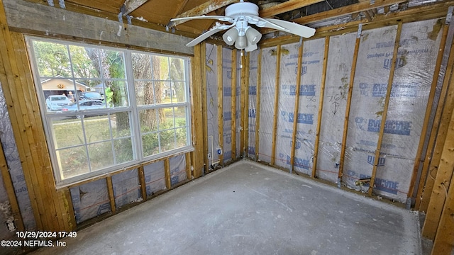 interior space with ceiling fan