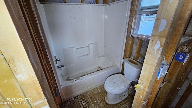 bathroom featuring  shower combination and toilet