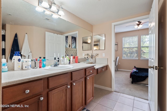 bathroom featuring vanity, a textured ceiling, ceiling fan, and tile patterned flooring