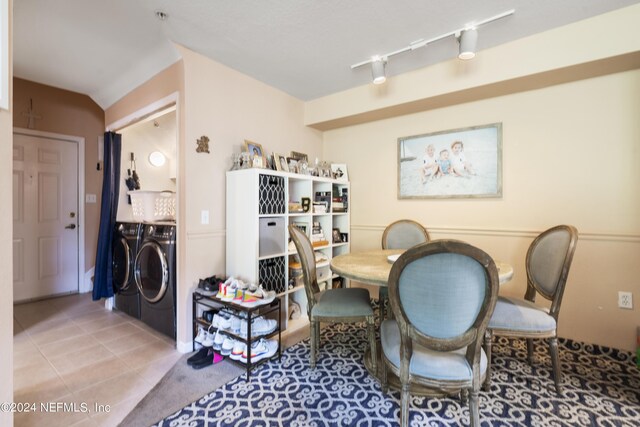 sitting room featuring track lighting, washer and dryer, and tile patterned flooring