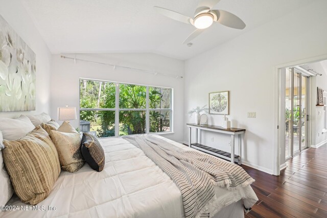 bedroom with access to outside, hardwood / wood-style flooring, vaulted ceiling, and ceiling fan