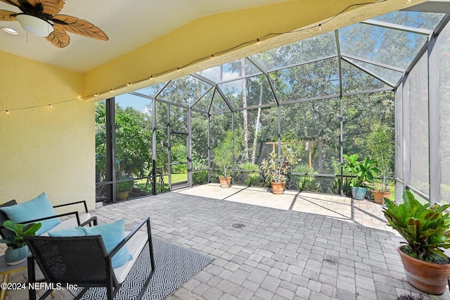 view of patio / terrace with a lanai and ceiling fan