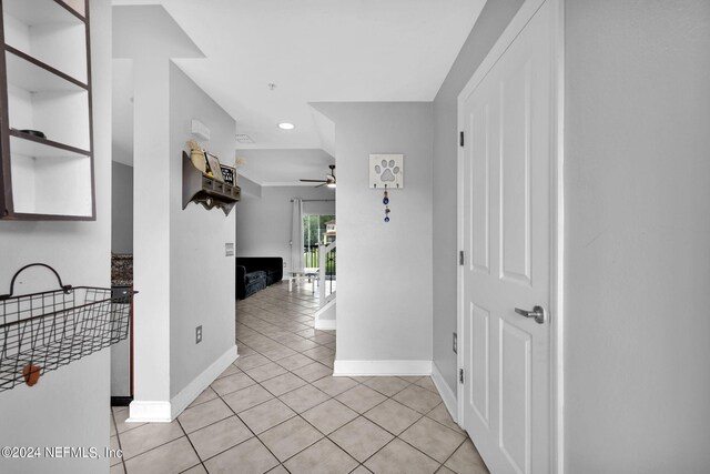 hallway featuring light tile patterned floors