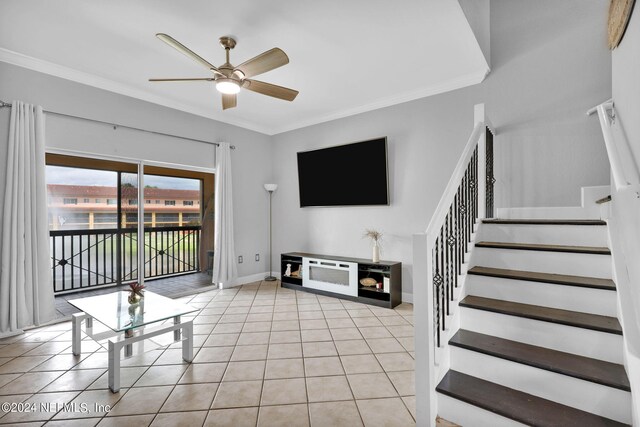 unfurnished living room featuring ceiling fan, ornamental molding, and light tile patterned floors