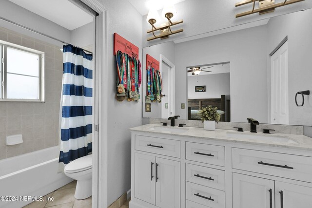 full bathroom featuring toilet, tile patterned flooring, vanity, shower / bathtub combination with curtain, and ceiling fan