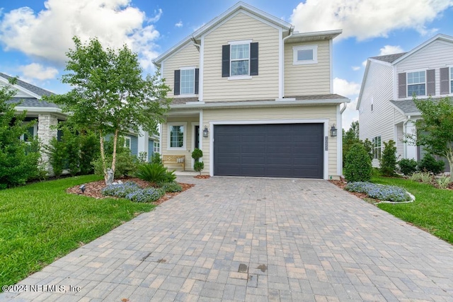 front of property featuring a garage and a front yard