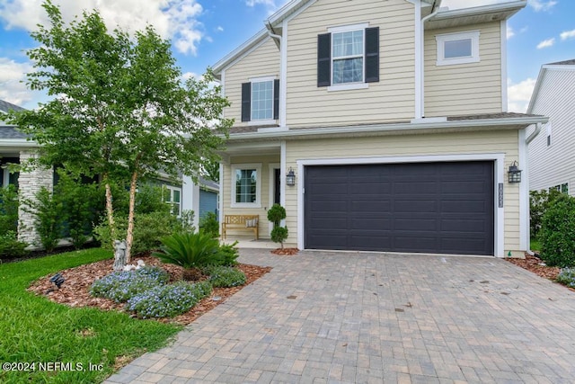 front of property featuring a garage