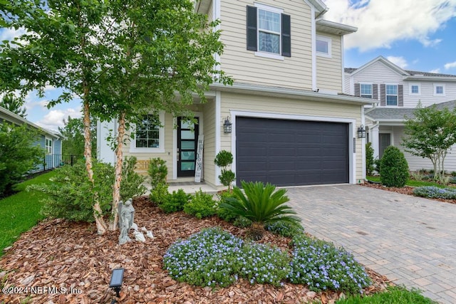 view of front of property with a garage