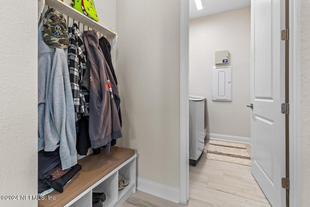 mudroom featuring washing machine and dryer and light hardwood / wood-style floors