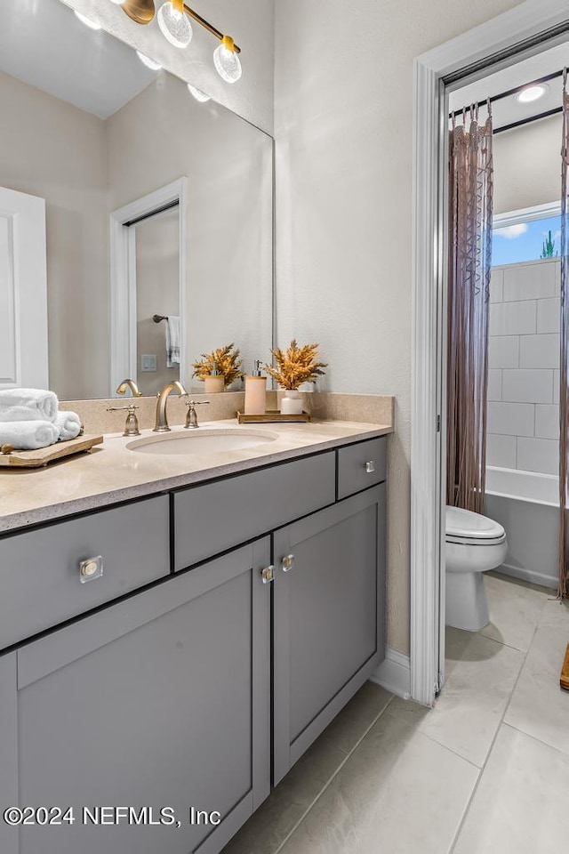 full bathroom featuring vanity, toilet, shower / tub combo, and tile patterned floors